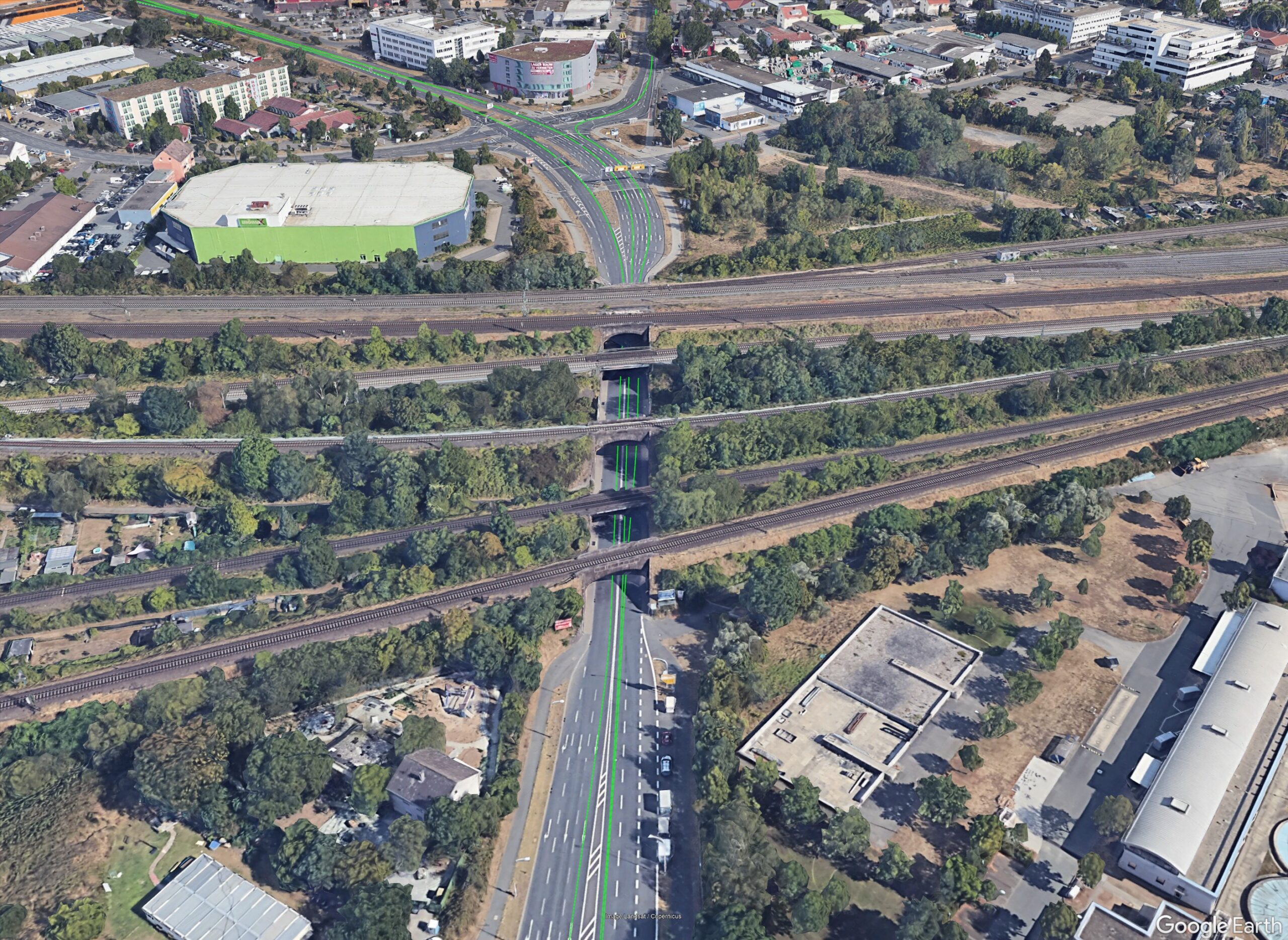 Vehicle approaching a bridge underpass with overlaid GNSS satellite geometry