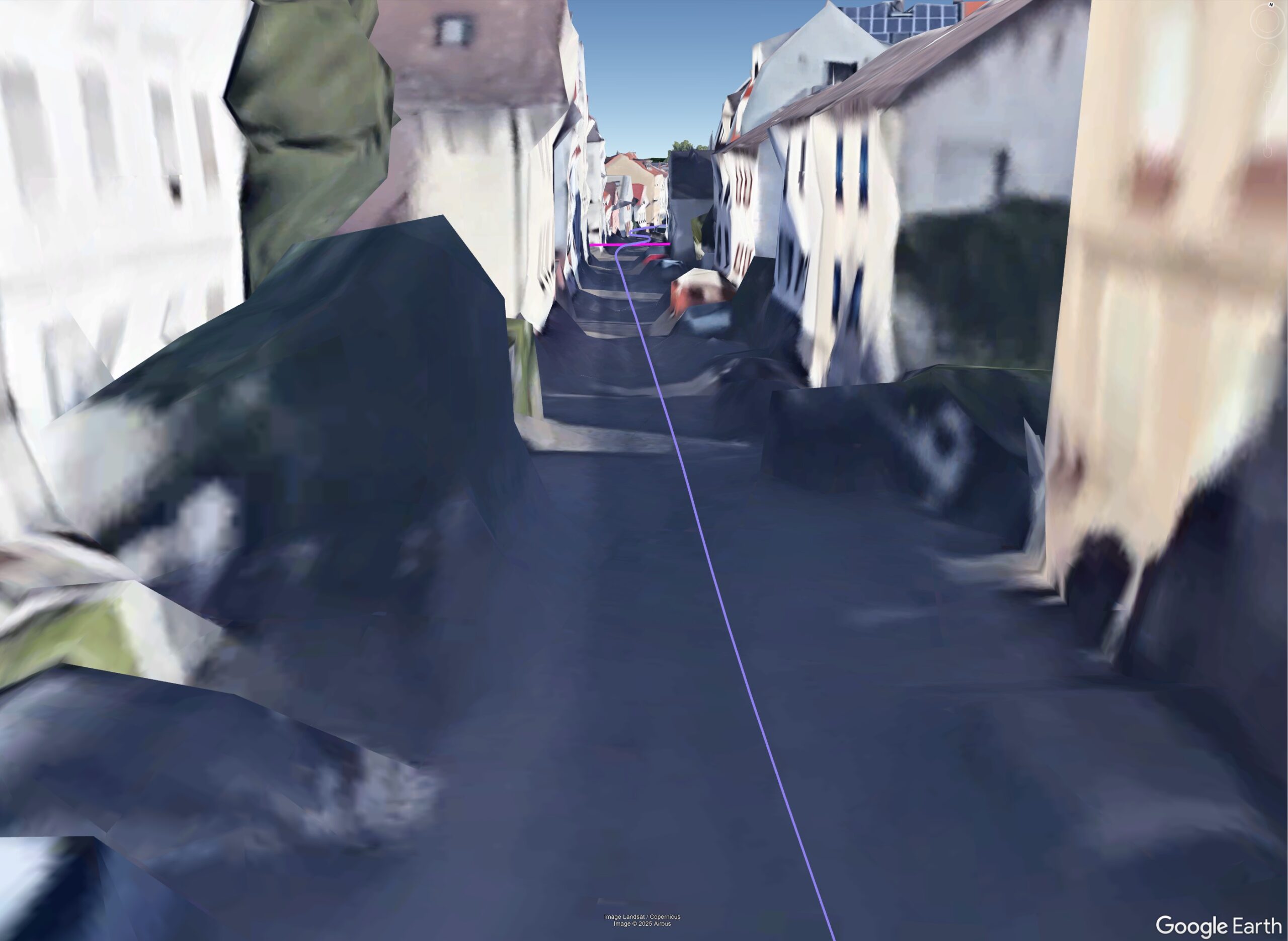 Dense old-town street with limited sky view