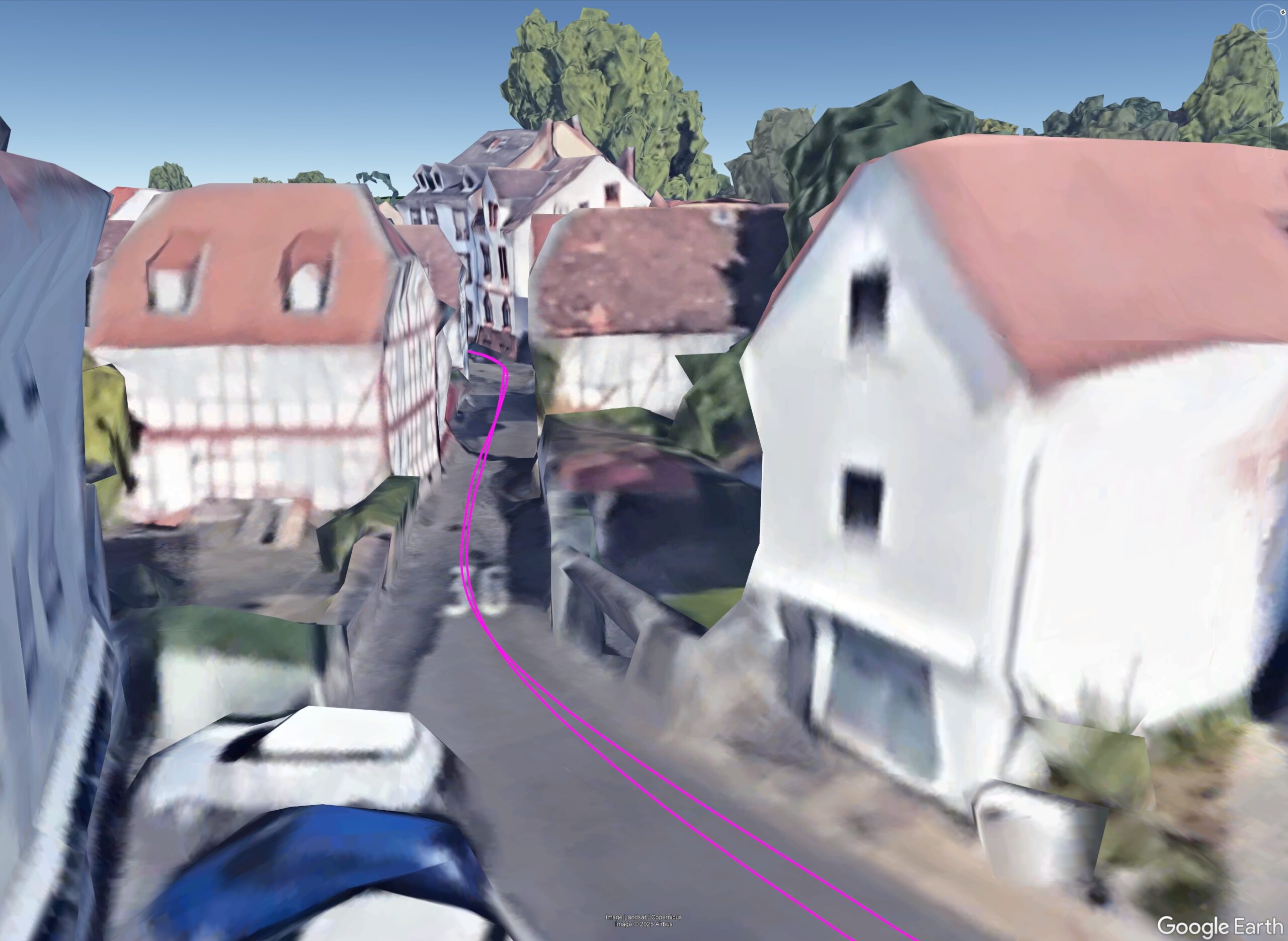 Narrow European urban canyon street with GNSS trajectory overlay